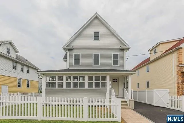 a front view of a house with a porch