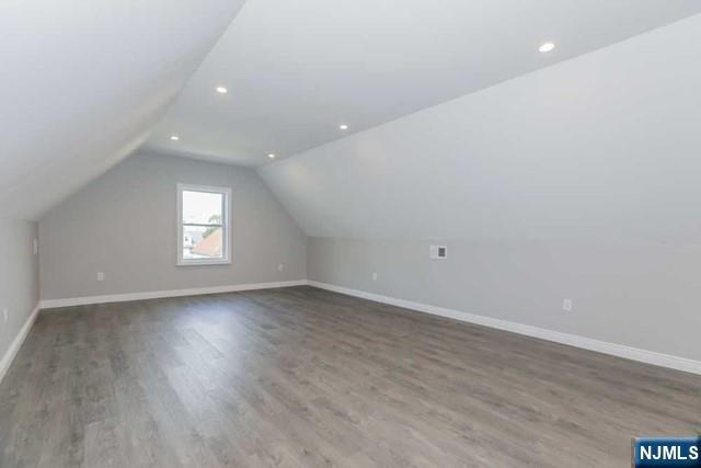 24 Henry Place, Unit 2 Hackensack, NJ 07601 - Photo 23 of 26 a view of an empty room with wooden floor and window