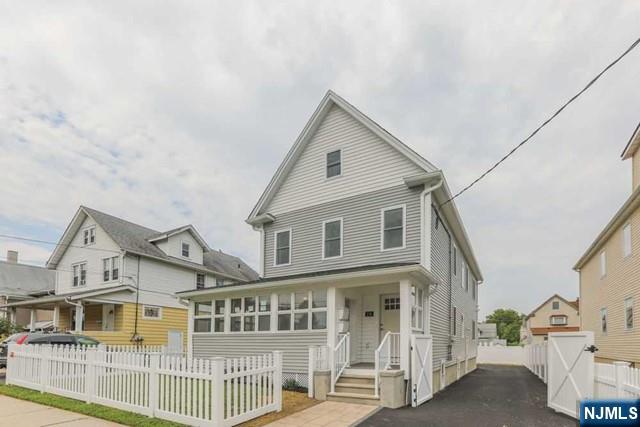24 Henry Place, Unit 2 Hackensack, NJ 07601 - Photo 3 of 26 a view of a white house with large windows