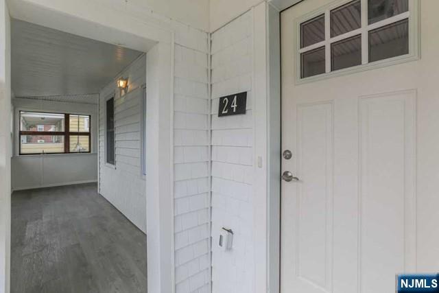 24 Henry Place, Unit 2 Hackensack, NJ 07601 - Photo 6 of 26 a view of a hallway with windows and entryway