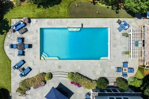 an aerial view of a house with a garden
