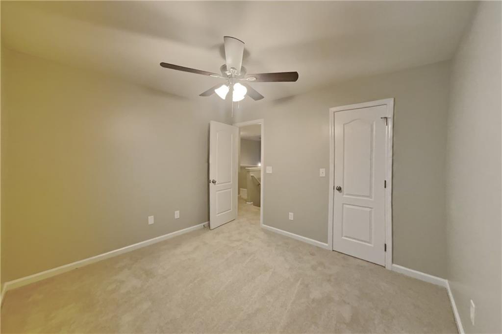 15 Jessica Lane Dallas, GA 30157 - Photo 12 of 23 a view of an empty room and a ceiling fan