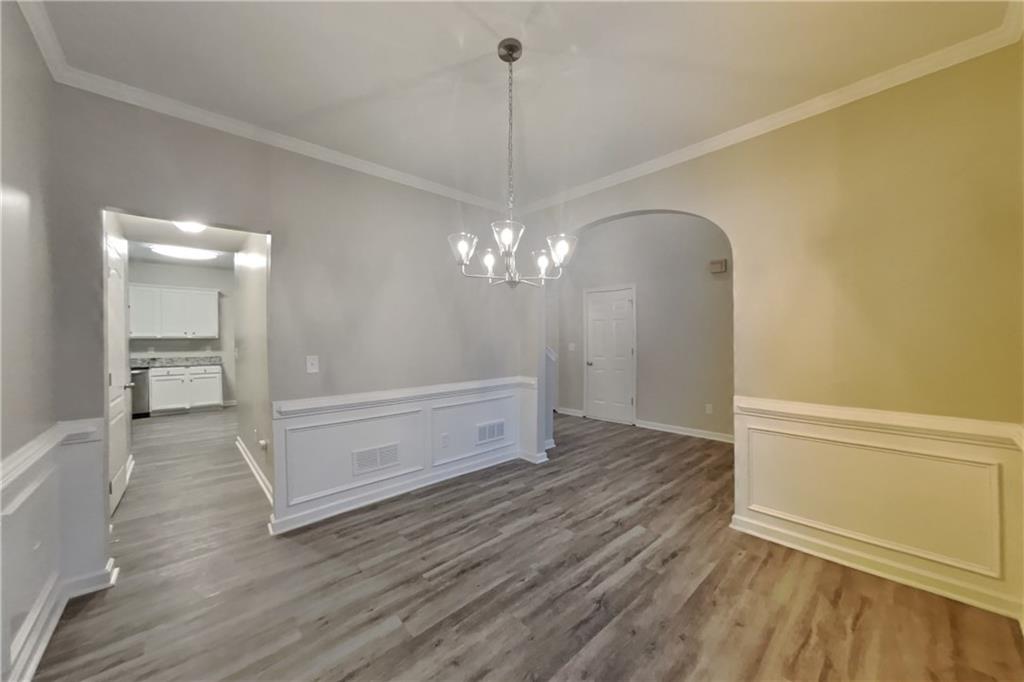 15 Jessica Lane Dallas, GA 30157 - Photo 5 of 23 a view of a room with wooden floor and a ceiling fan