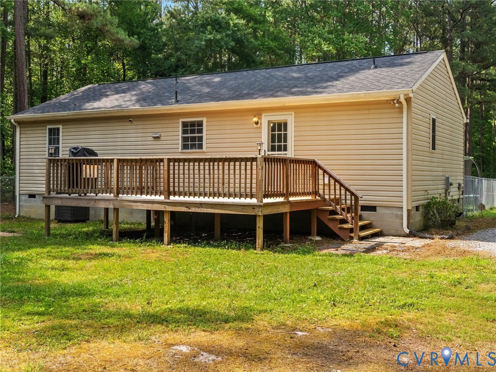 14175 Lebanon Road Disputanta, VA 23842 - Photo 41 of 60 Rear exterior featuring a spacious wooden deck wit