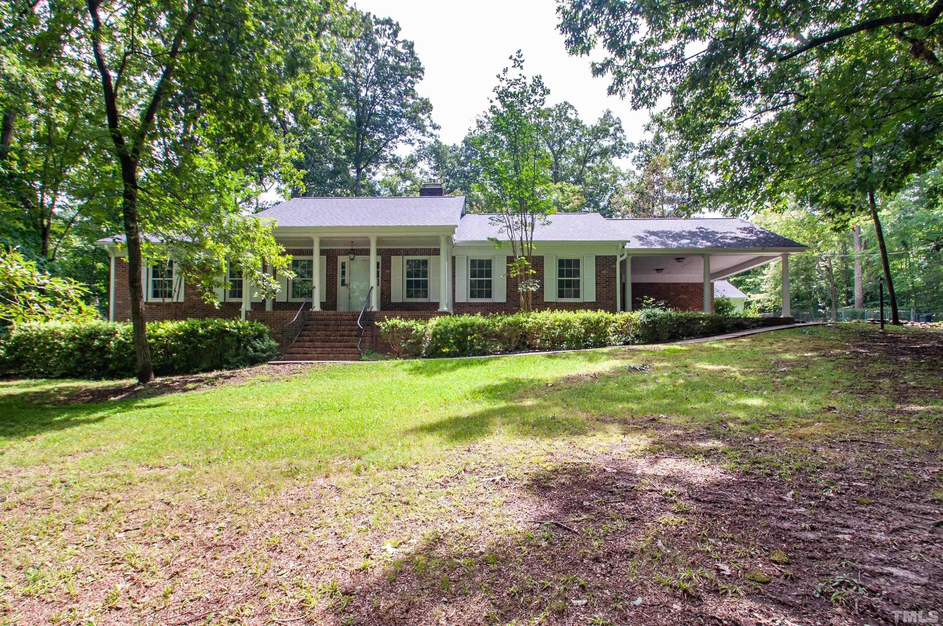8408 Azalea Place Raleigh, NC 27613 - Photo 1 of 48 a front view of house with yard and green space