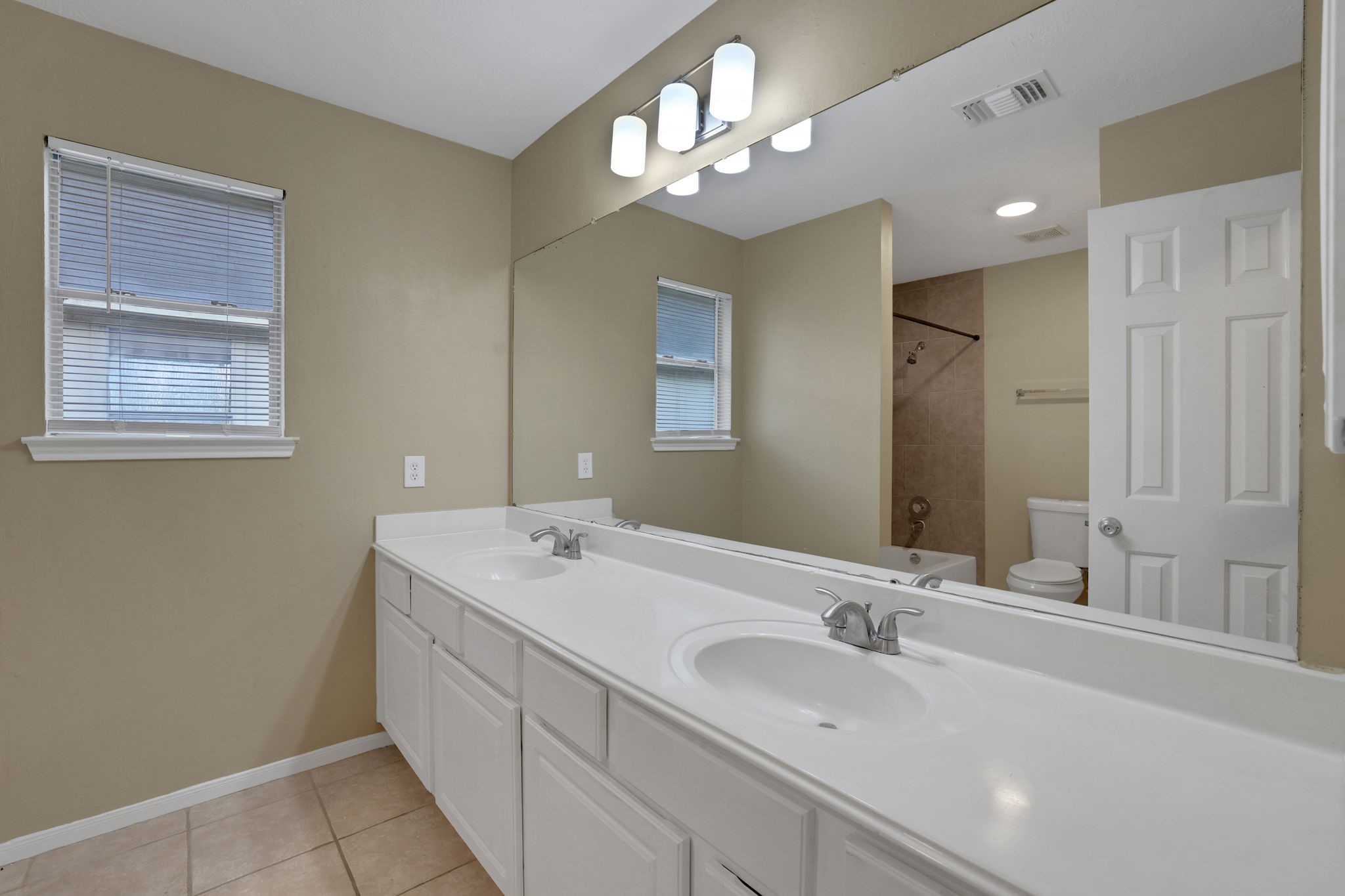 23207 Olive Ridge Court Katy, TX 77494 - Photo 37 of 46 a bathroom with a double vanity sink and a mirror