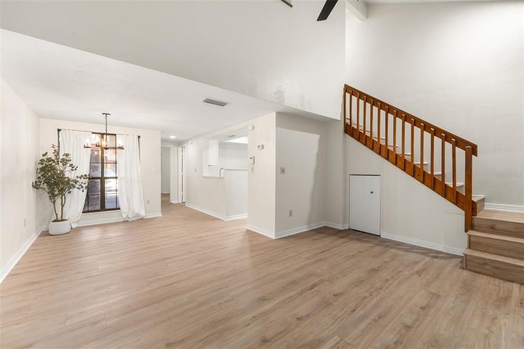 912 Southwest 57th Drive Gainesville, FL 32607 - Photo 12 of 34 a view of an empty room with wooden floor