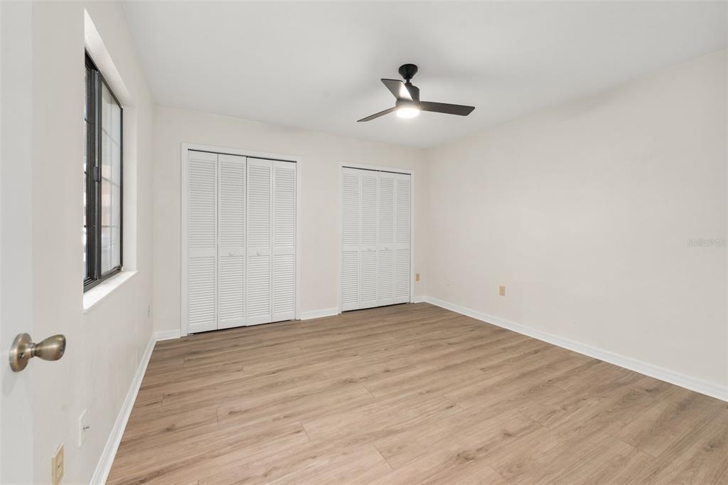 912 Southwest 57th Drive Gainesville, FL 32607 - Photo 15 of 34 a view of empty room with wooden floor