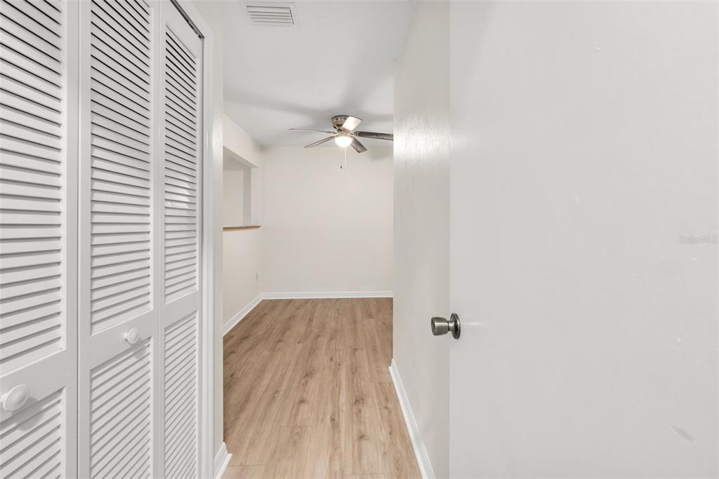 912 Southwest 57th Drive Gainesville, FL 32607 - Photo 19 of 34 a view of a hallway with wooden floor