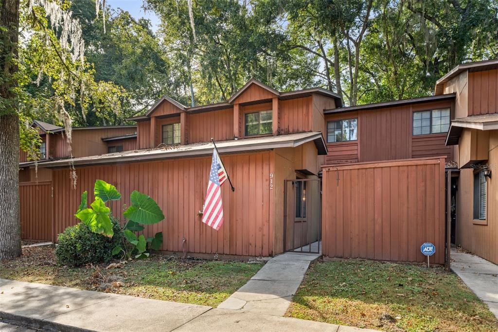 912 Southwest 57th Drive Gainesville, FL 32607 - Photo 28 of 34 a view of a small house with a garage