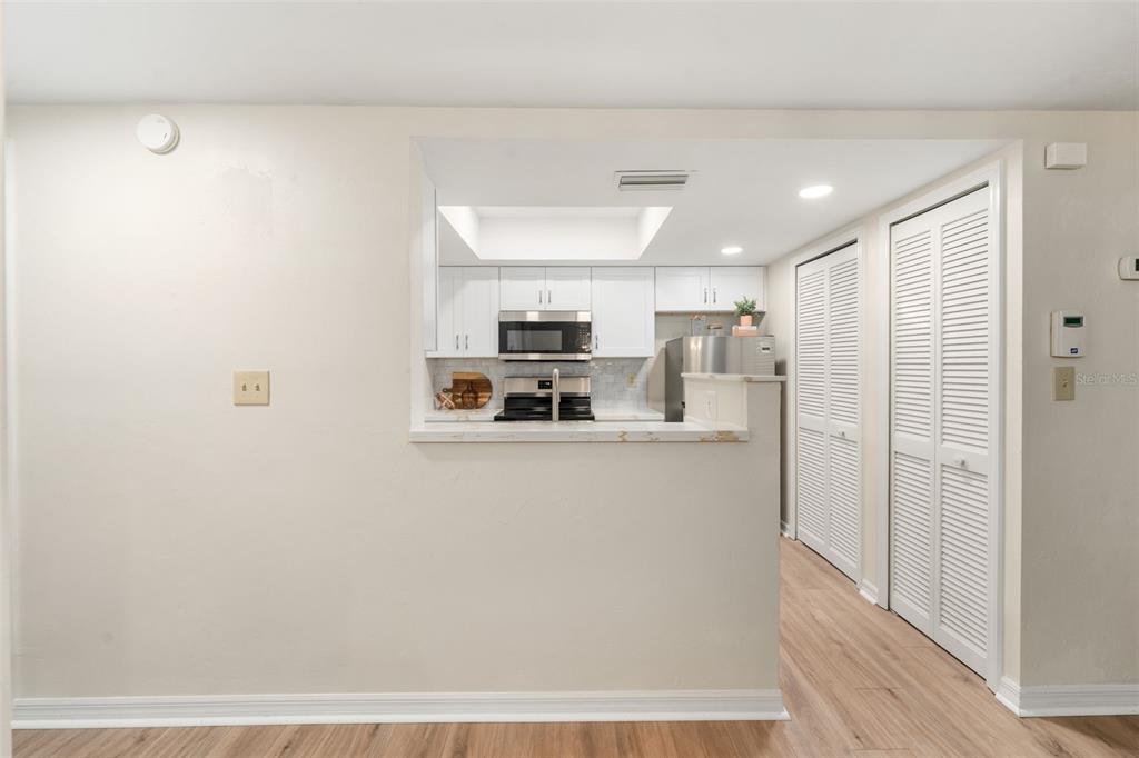 912 Southwest 57th Drive Gainesville, FL 32607 - Photo 4 of 34 a kitchen with stainless steel appliances a refrigerator and a stove top oven