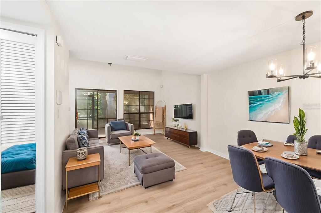912 Southwest 57th Drive Gainesville, FL 32607 - Photo 6 of 34 a living room with furniture and a flat screen tv
