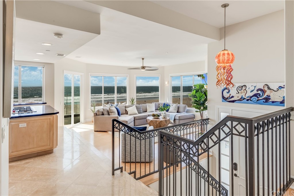 2220 The Strand Manhattan Beach, CA 90266 - Photo 13 of 44 a view of a dining room and livingroom with furniture wooden floor a chandelier