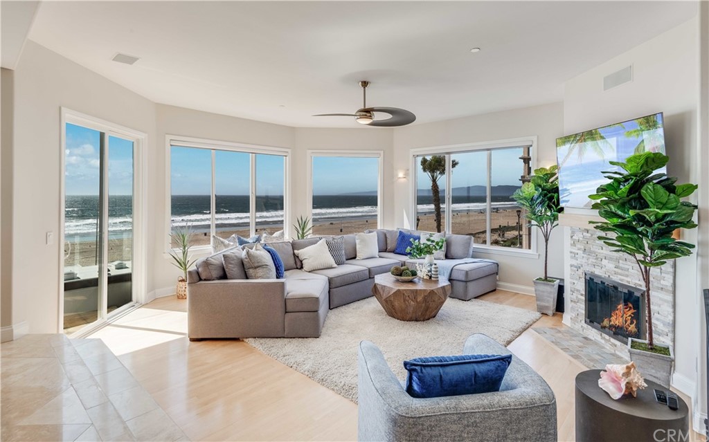 2220 The Strand Manhattan Beach, CA 90266 - Photo 14 of 44 a living room with furniture and a fireplace