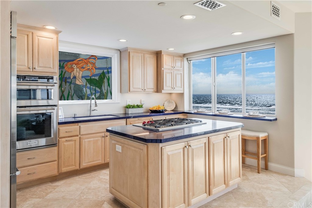 2220 The Strand Manhattan Beach, CA 90266 - Photo 19 of 44 a kitchen with stainless steel appliances granite countertop a stove and a sink