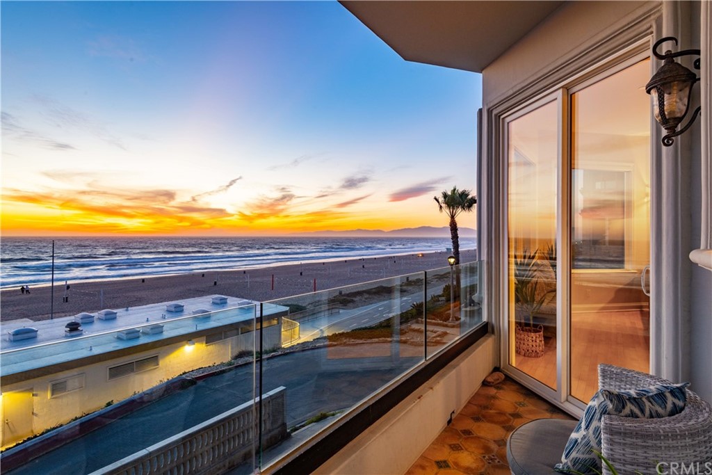 2220 The Strand Manhattan Beach, CA 90266 - Photo 3 of 44 a view of a balcony with chair and a floor to ceiling window