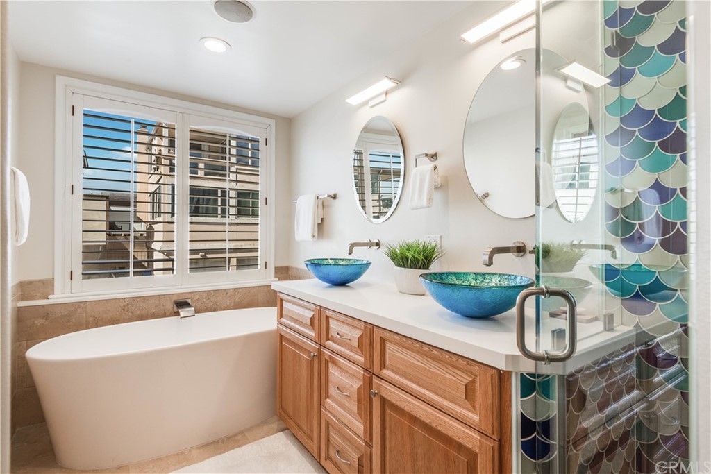 2220 The Strand Manhattan Beach, CA 90266 - Photo 32 of 44 a bathroom with a double vanity sink and a mirror