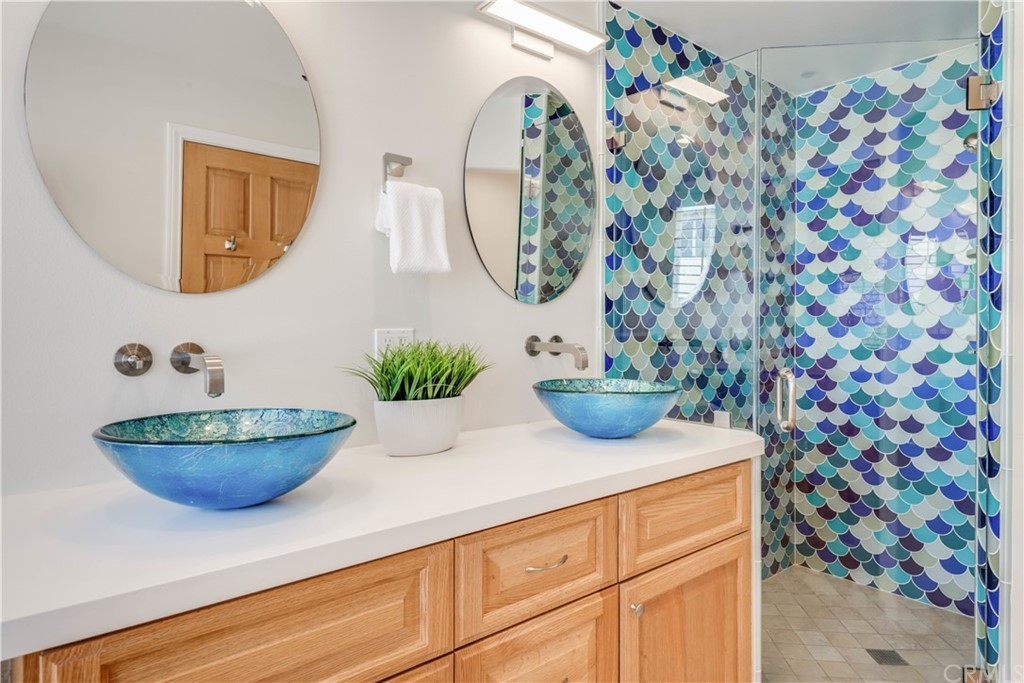 2220 The Strand Manhattan Beach, CA 90266 - Photo 33 of 44 a bathroom with a sink and a mirror