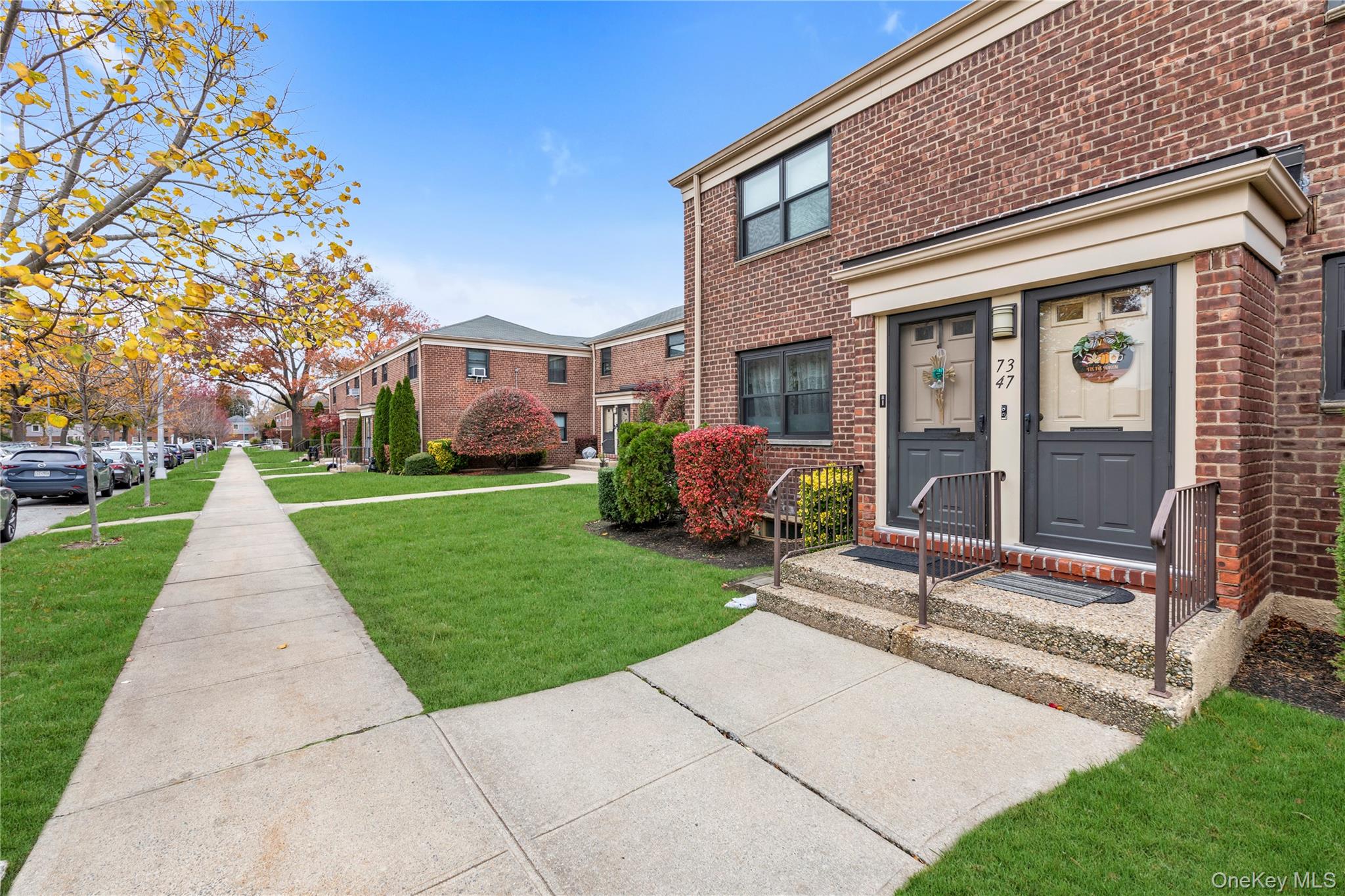 73-47 217th Street, Unit 364A2 Queens, NY 11364 - Photo 11 of 12 a front view of house with yard