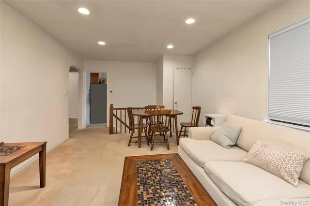 a living room with furniture and a rug