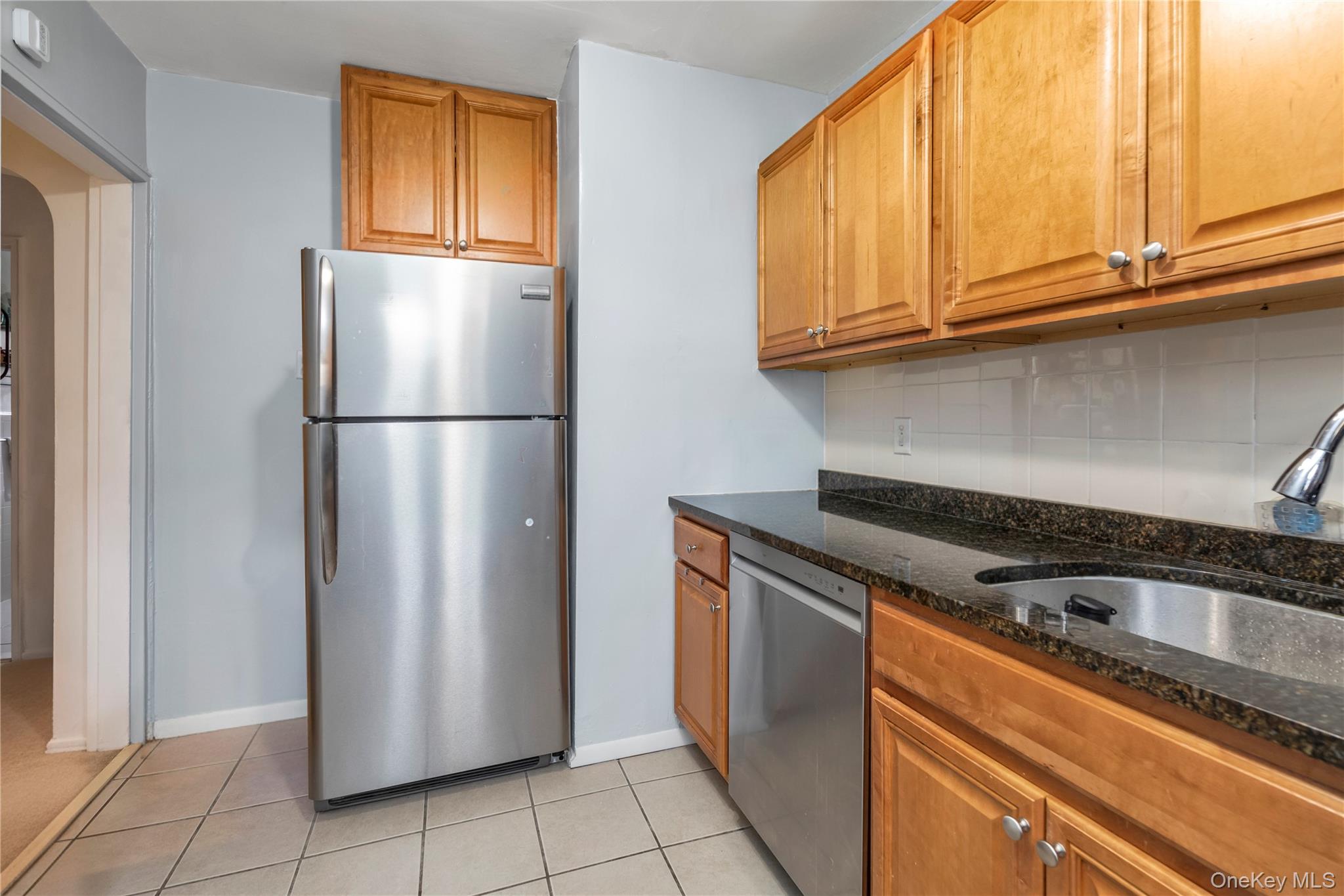 73-47 217th Street, Unit 364A2 Queens, NY 11364 - Photo 6 of 12 a view of a kitchen with electric appliances