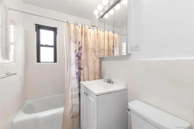 a bathroom with a sink a toilet and a bathtub