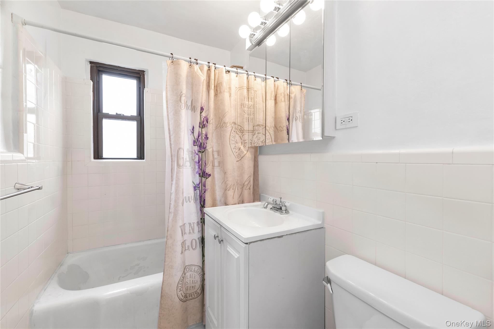 73-47 217th Street, Unit 364A2 Queens, NY 11364 - Photo 10 of 12 a bathroom with a sink a toilet and a bathtub