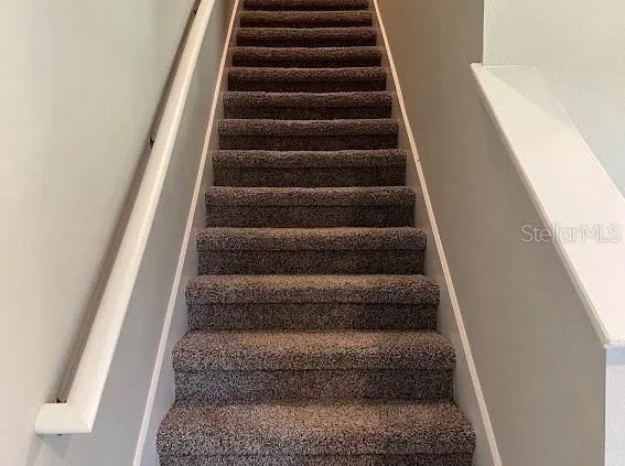 a view of staircase with empty racks