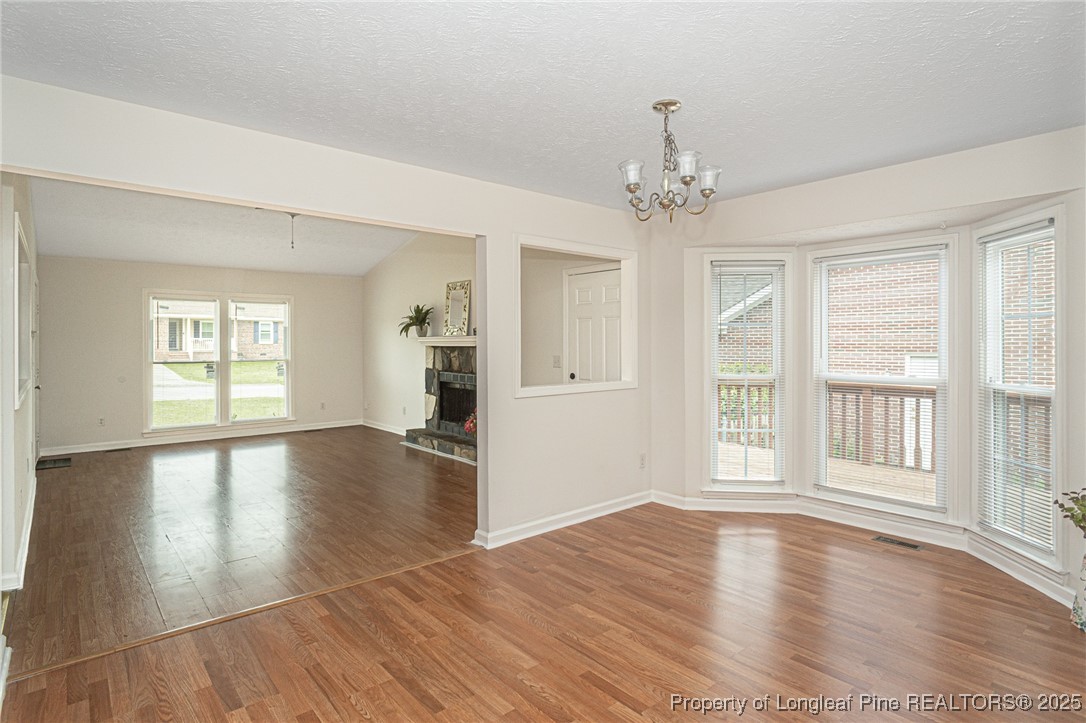 6576 Applewhite Road Fayetteville, NC 28304 - Photo 11 of 35 a view of an empty room with wooden floor and a window