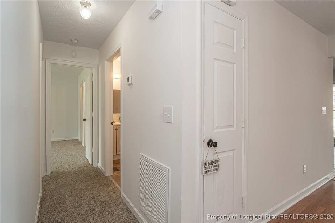 6576 Applewhite Road Fayetteville, NC 28304 - Photo 12 of 35 a view of a hallway with closet
