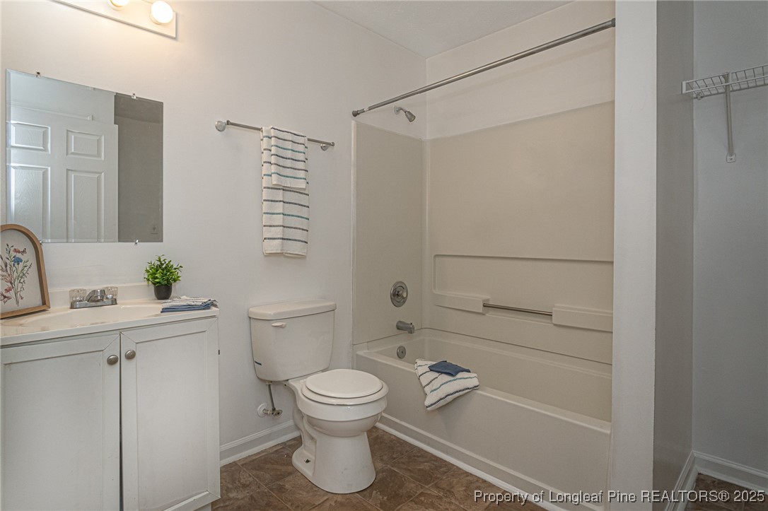 6576 Applewhite Road Fayetteville, NC 28304 - Photo 18 of 35 a bathroom with a toilet sink and shower