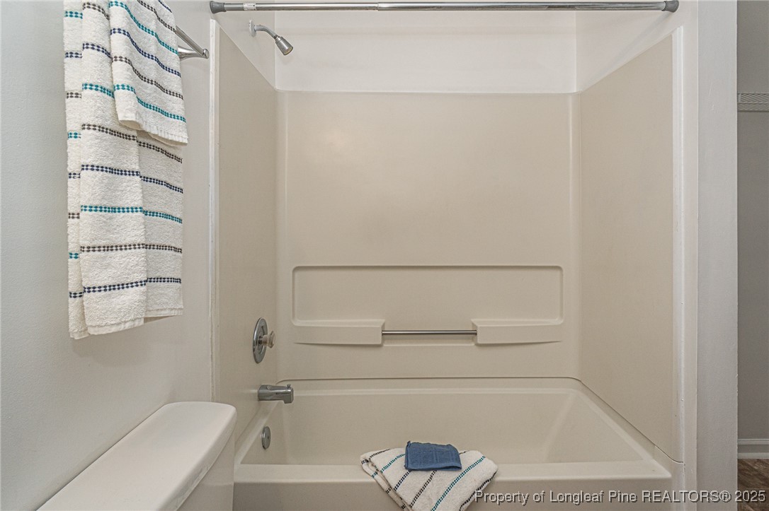 6576 Applewhite Road Fayetteville, NC 28304 - Photo 19 of 35 a bathroom with a bathtub and a shower