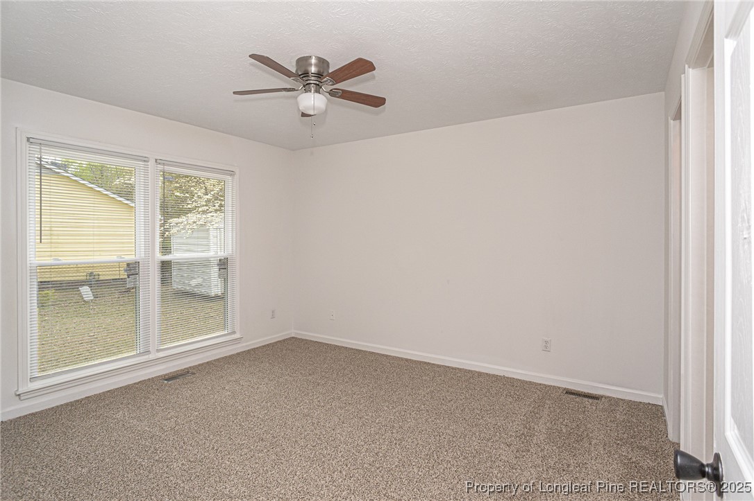 6576 Applewhite Road Fayetteville, NC 28304 - Photo 22 of 35 an empty room with a window