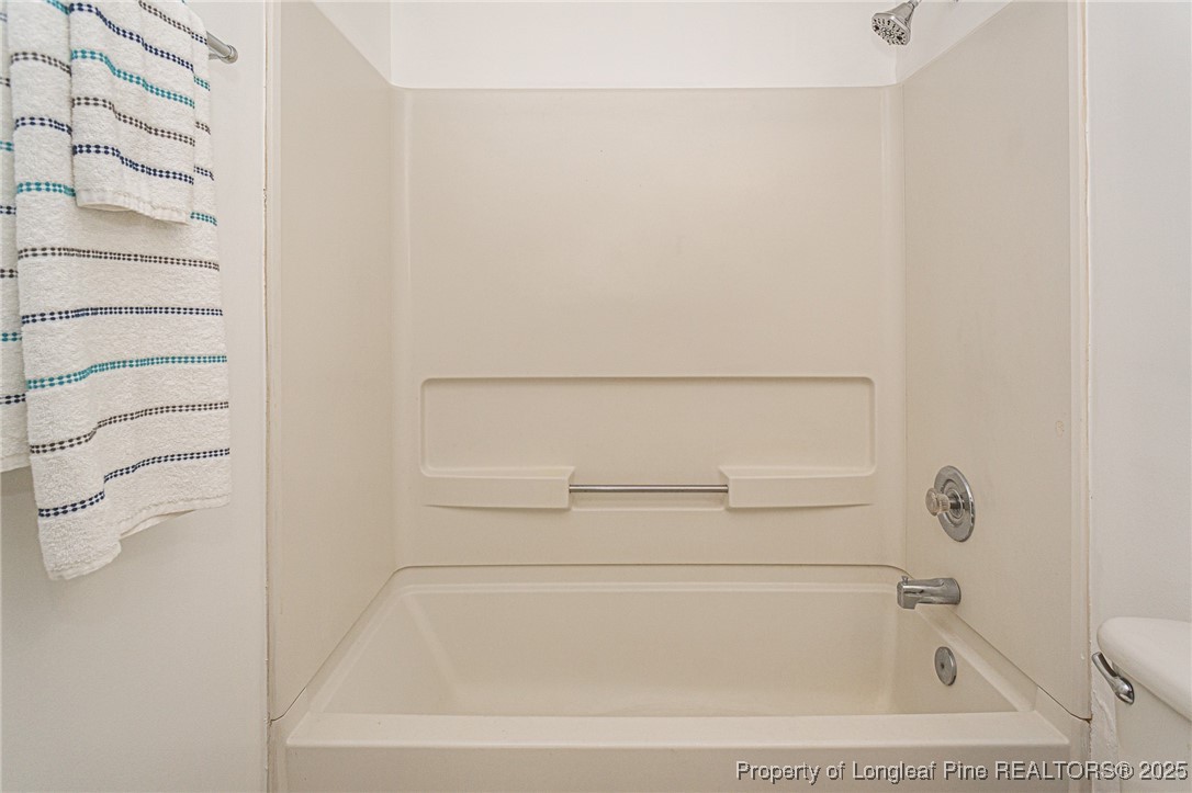 6576 Applewhite Road Fayetteville, NC 28304 - Photo 26 of 35 a bathroom with a bathtub