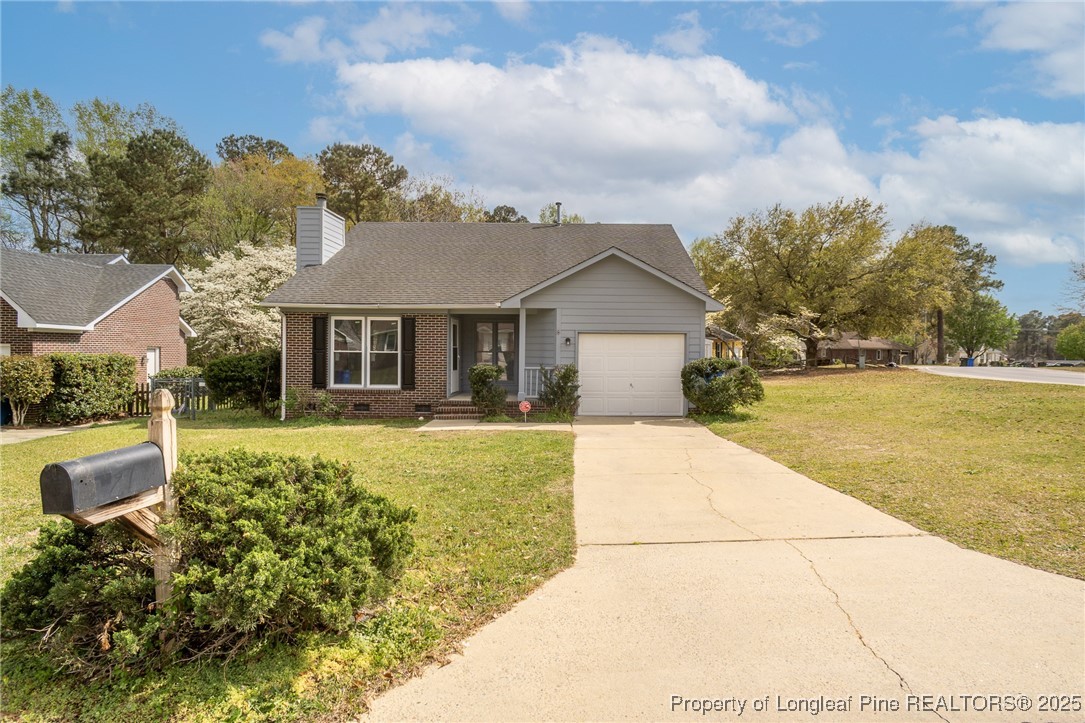 6576 Applewhite Road Fayetteville, NC 28304 - Photo 33 of 35 a front view of a house with garden