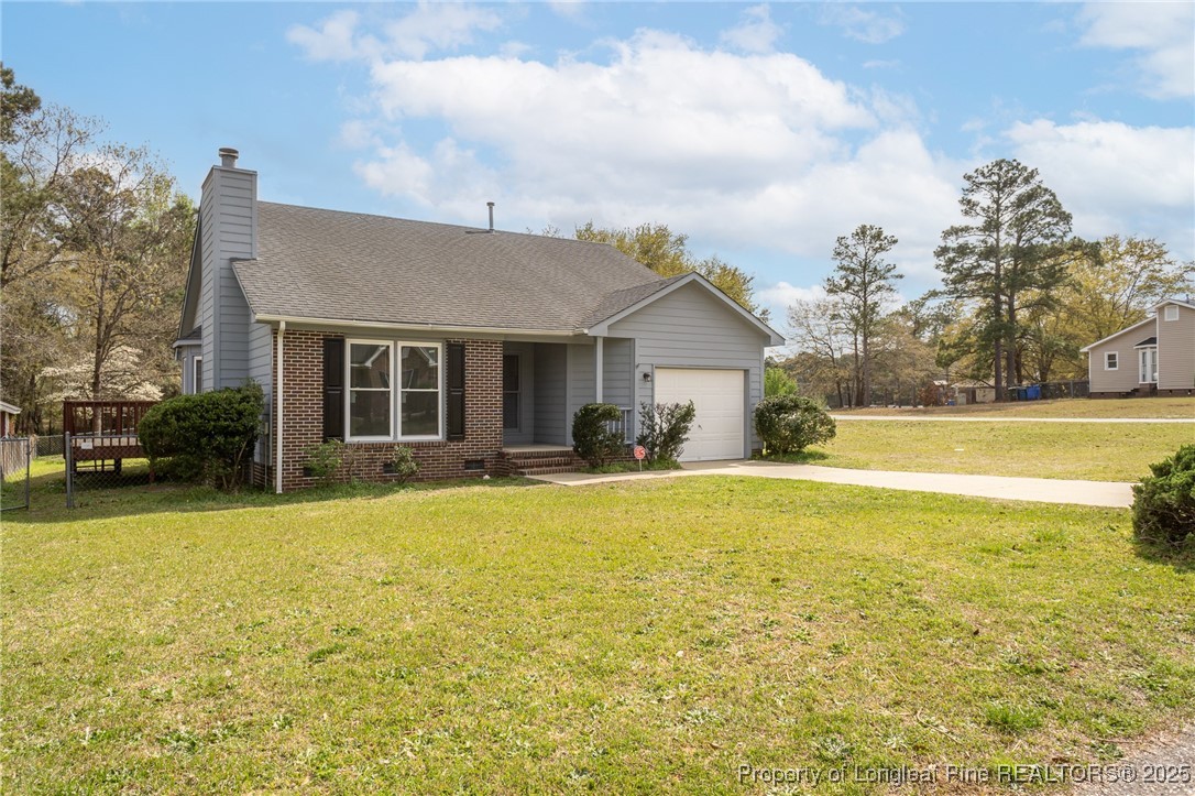 6576 Applewhite Road Fayetteville, NC 28304 - Photo 35 of 35 a front view of house with yard and swimming pool