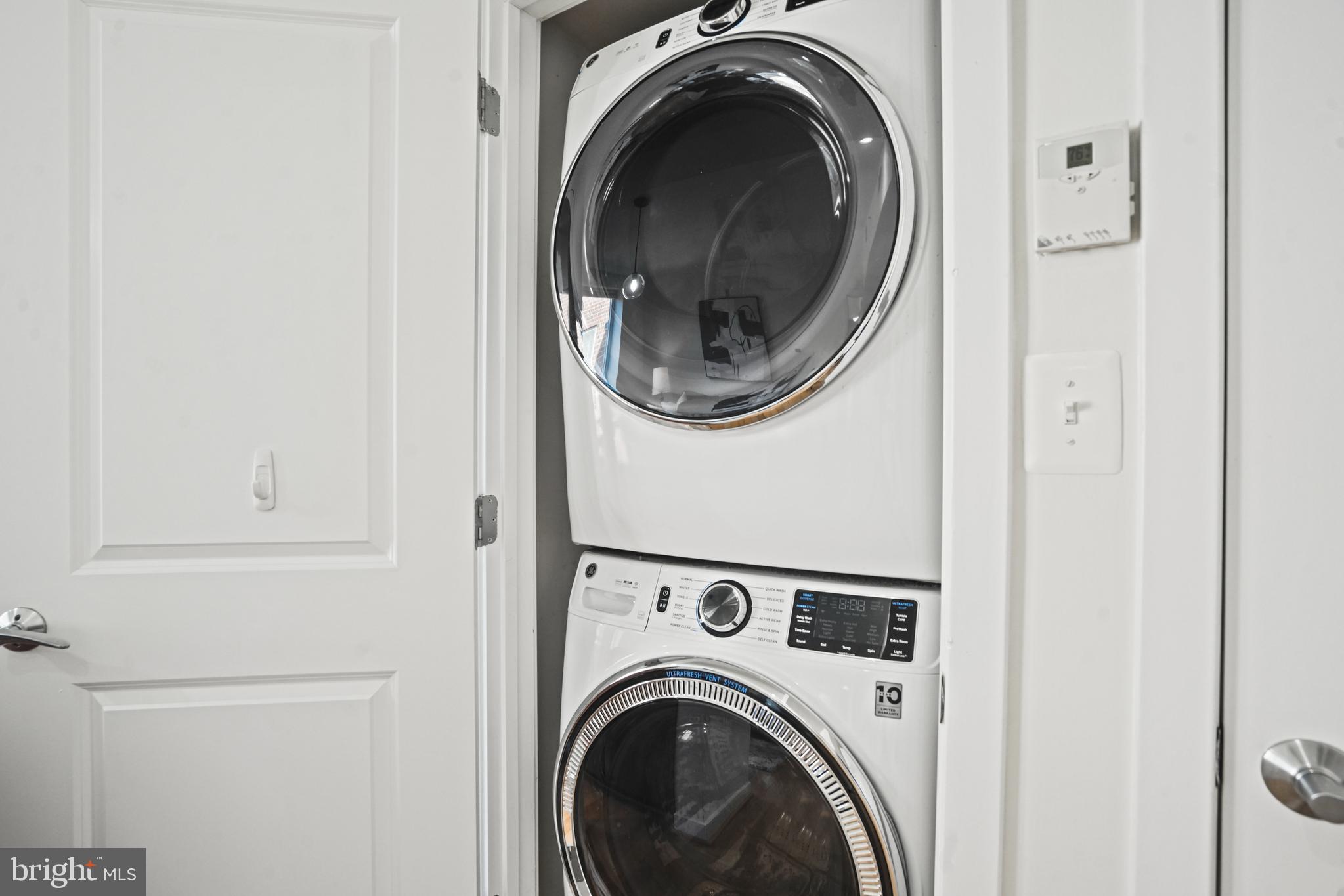 420 16th Street Southeast, Unit 103 Washington, DC 20003 - Photo 13 of 16 a view of a hallway with washer and dryer