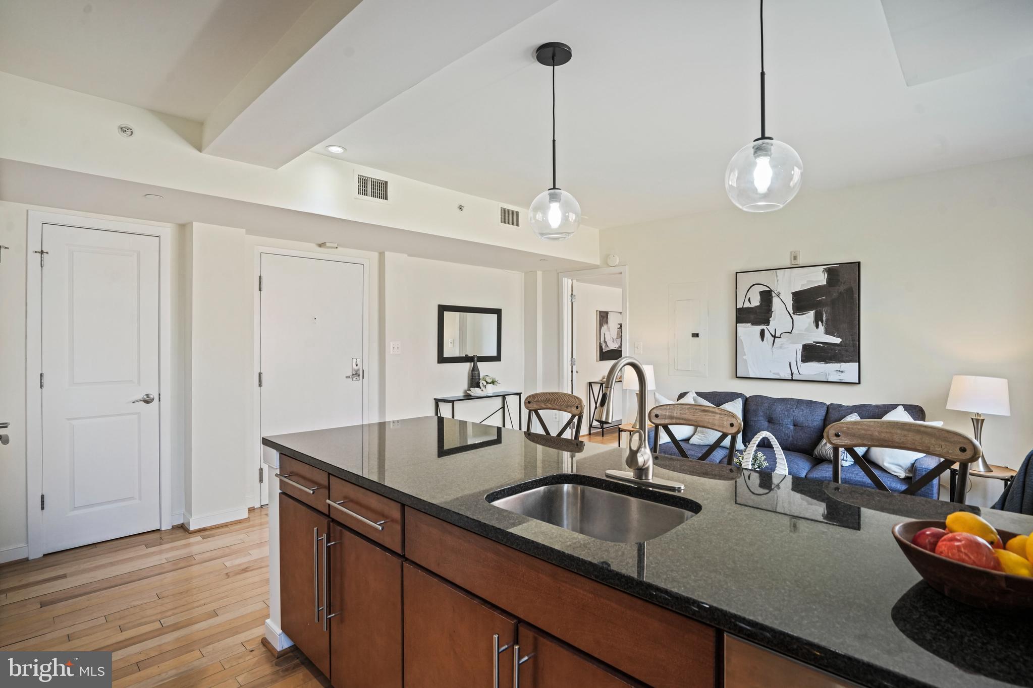 420 16th Street Southeast, Unit 103 Washington, DC 20003 - Photo 5 of 16 a kitchen with counter top space and wooden floor