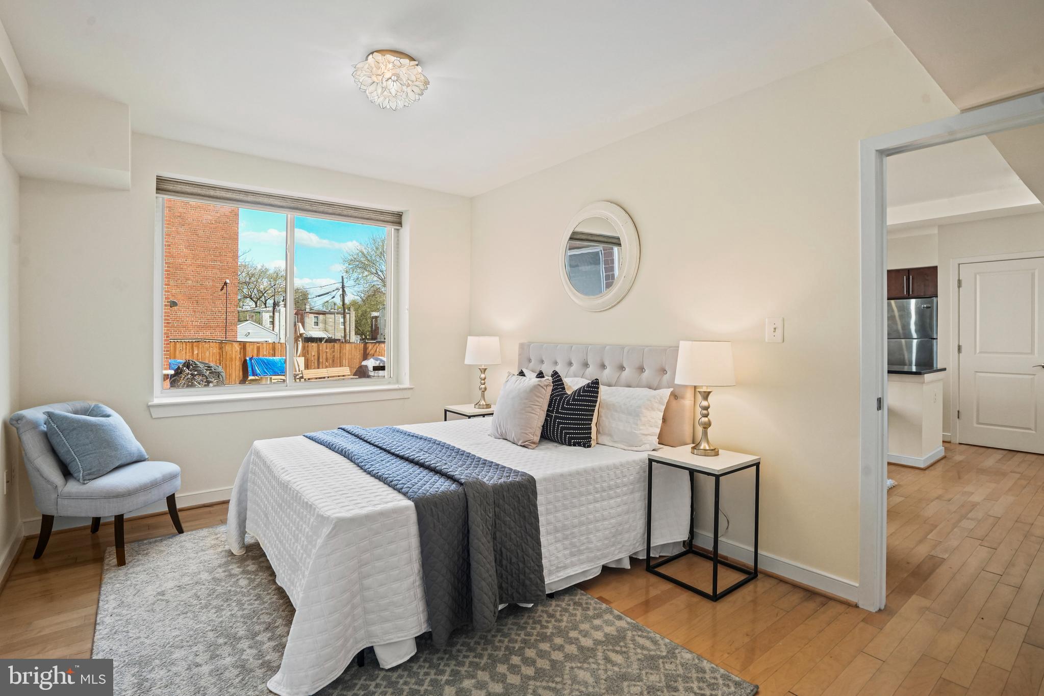 420 16th Street Southeast, Unit 103 Washington, DC 20003 - Photo 8 of 16 a bedroom with a bed and a window