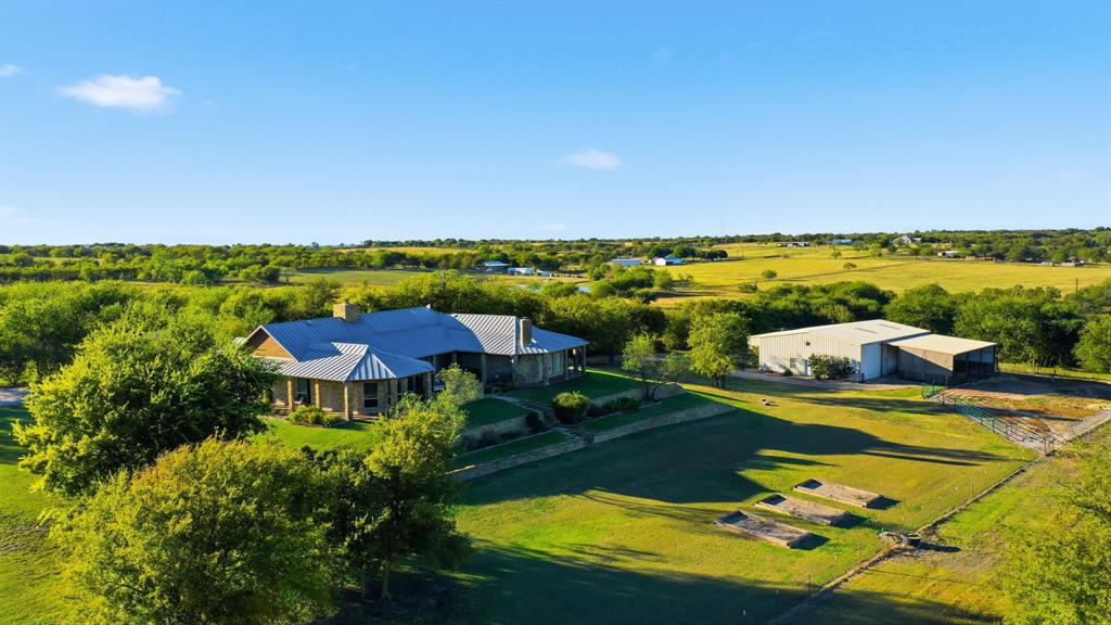 135 Serrano Court Weatherford, TX 76087 - Photo 1 of 1 a view of a lake with a patio