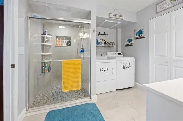a bathroom with a tub sink and mirror