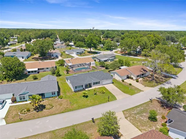 an aerial view of a house with a garden