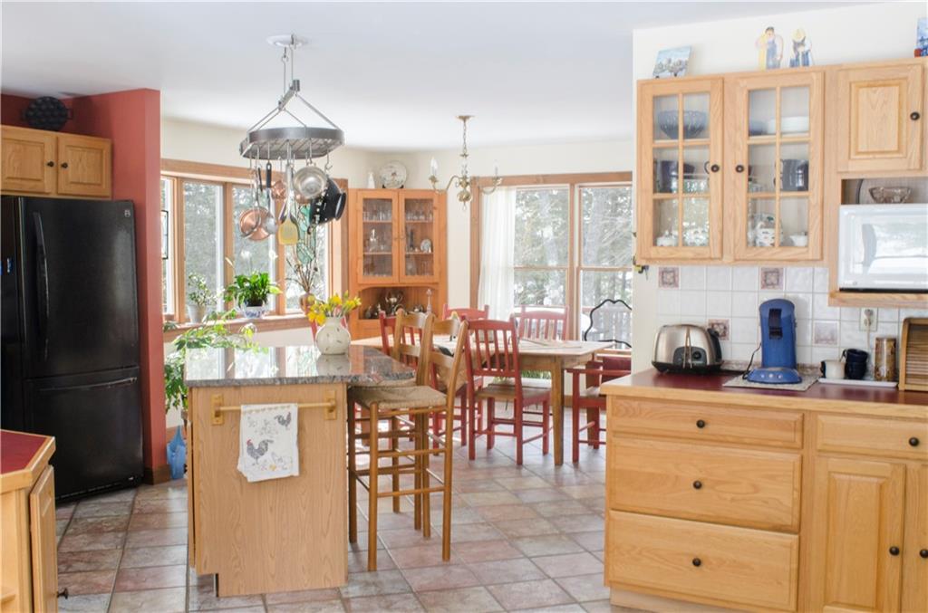 242 Middle Road Woolwich, ME 04579 - Photo 12 of 32 Kitchen island with granite and bar...