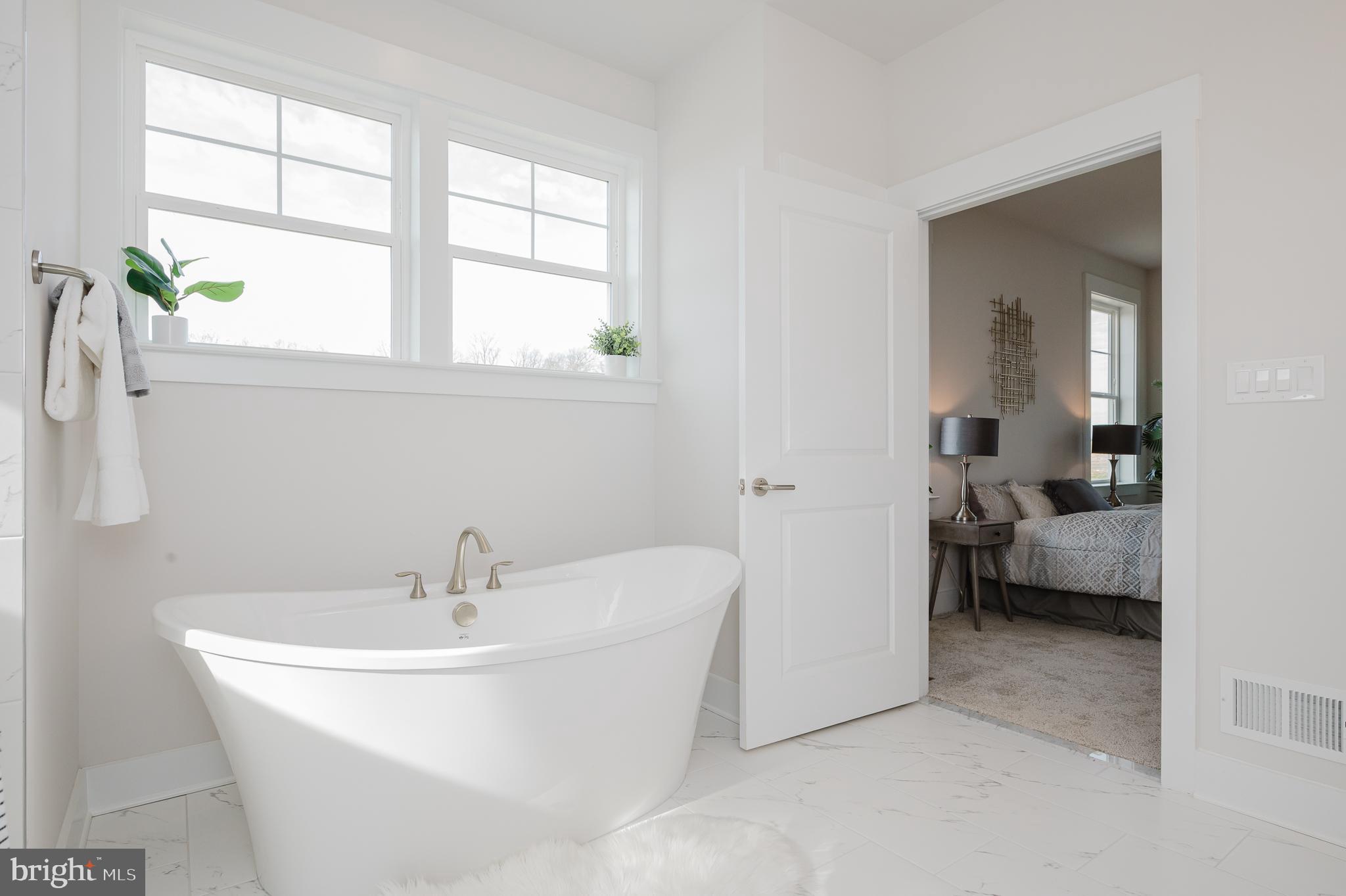 1605 A Oakland Road Freeland, MD 21053 - Photo 27 of 32 a white bath tub sitting next to a white sink