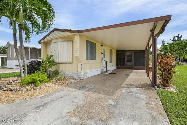 a view of a house with a small yard