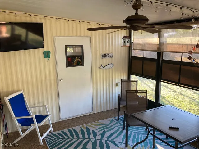 a view of a dining room with furniture and window