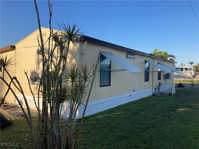 a house view with a backyard space