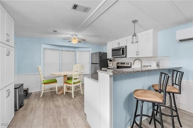 a view of kitchen with breakfast area