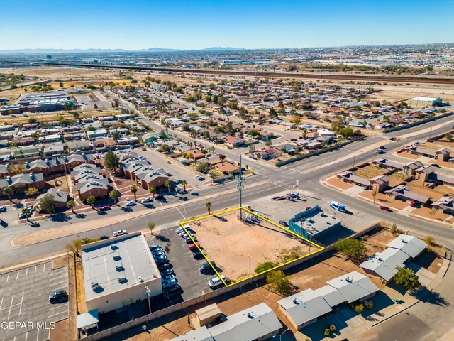 an aerial view of a parking space and ocean view