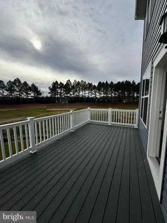 a view of deck with wooden floor and seating space